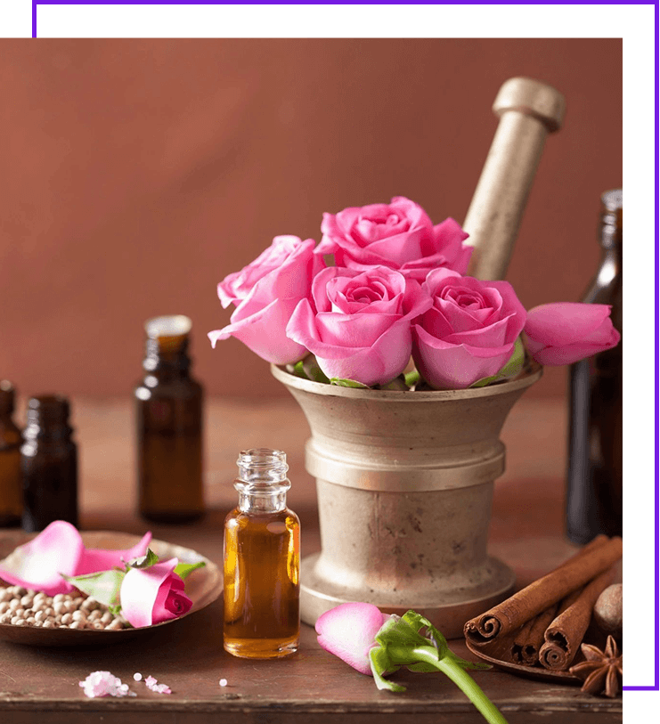 A mortar and pestle with pink roses in it.